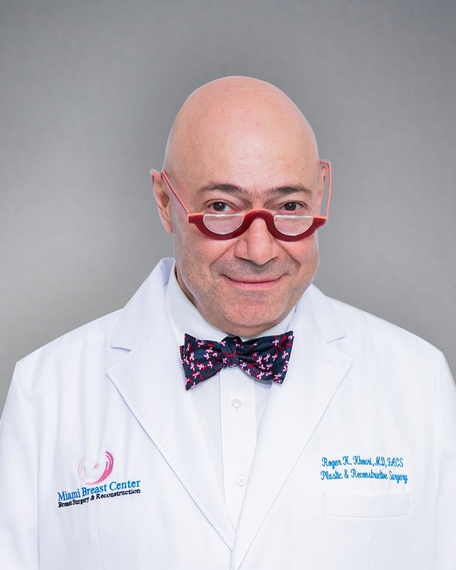Dr. Roger Khouri in a white coat