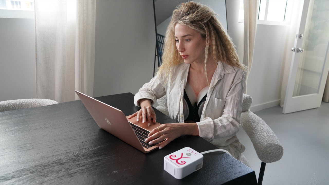 Woman wearing EVEBRA while working at a desk at home